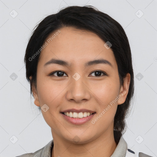 Joyful asian young-adult female with medium  black hair and brown eyes