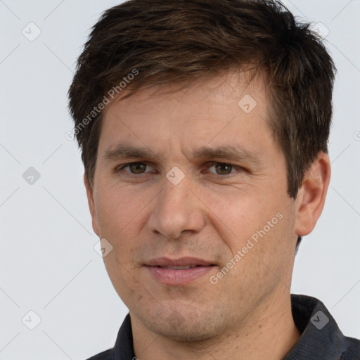 Joyful white adult male with short  brown hair and brown eyes