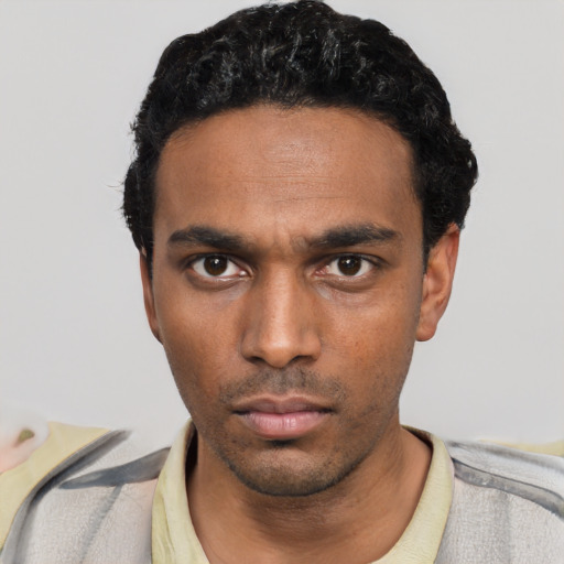 Neutral black young-adult male with short  black hair and brown eyes
