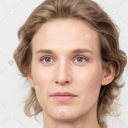 Joyful white young-adult female with medium  brown hair and blue eyes