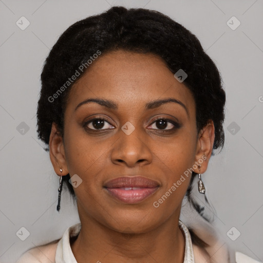 Joyful black young-adult female with short  brown hair and brown eyes