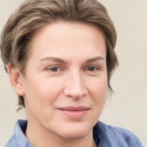 Joyful white adult female with short  brown hair and grey eyes