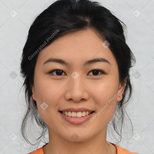 Joyful asian young-adult female with medium  black hair and brown eyes