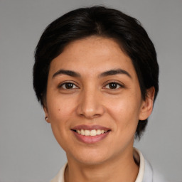 Joyful white young-adult female with medium  brown hair and brown eyes