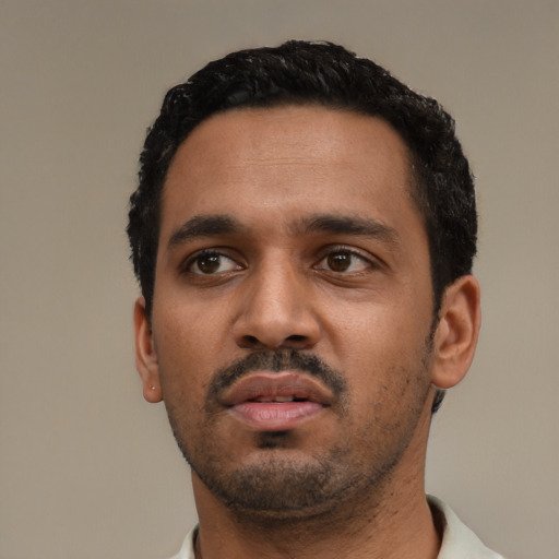 Neutral black young-adult male with short  black hair and brown eyes