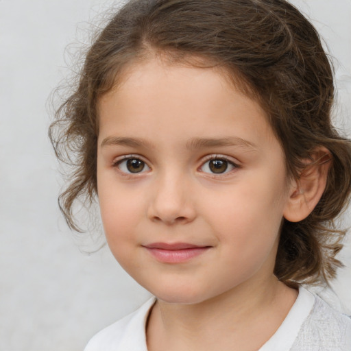 Joyful white child female with medium  brown hair and brown eyes