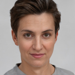 Joyful white adult female with short  brown hair and brown eyes