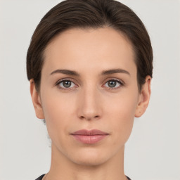 Neutral white young-adult female with short  brown hair and brown eyes