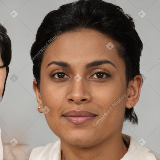 Joyful latino young-adult female with medium  brown hair and brown eyes