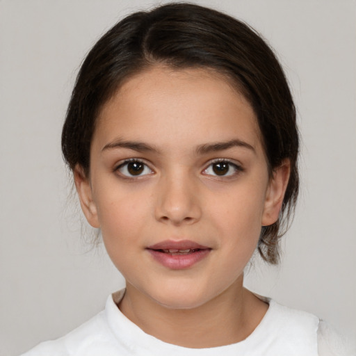 Joyful white child female with medium  brown hair and brown eyes