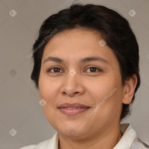 Joyful white adult female with short  brown hair and brown eyes