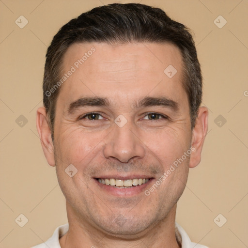 Joyful white adult male with short  brown hair and brown eyes