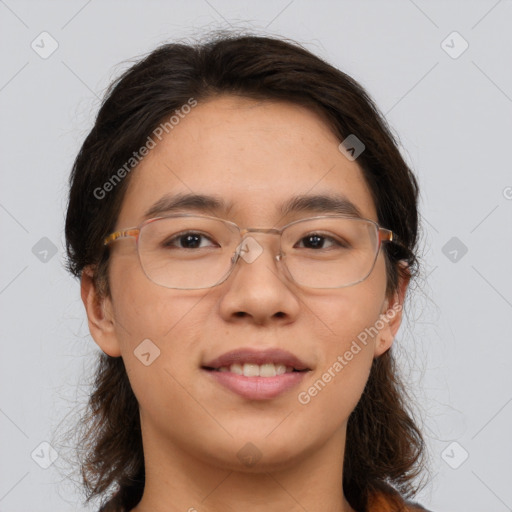 Joyful white adult female with medium  brown hair and brown eyes
