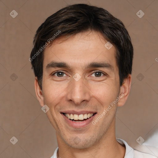 Joyful white young-adult male with short  brown hair and brown eyes