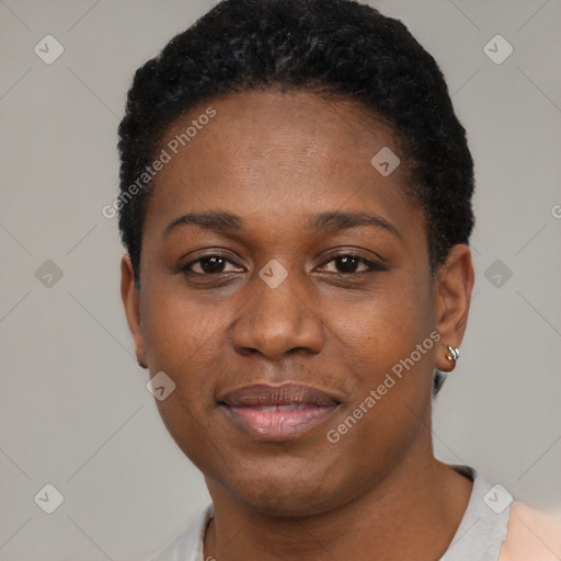 Joyful black young-adult female with short  black hair and brown eyes