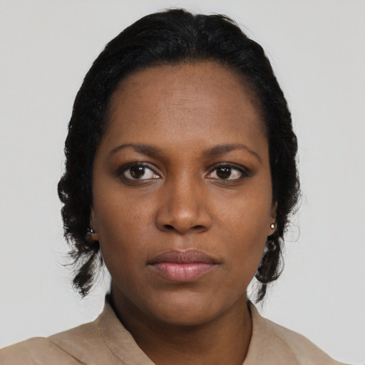 Neutral black young-adult female with short  black hair and brown eyes