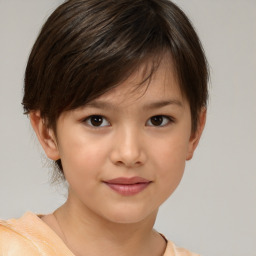 Joyful white child female with short  brown hair and brown eyes