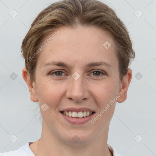 Joyful white young-adult female with short  brown hair and grey eyes