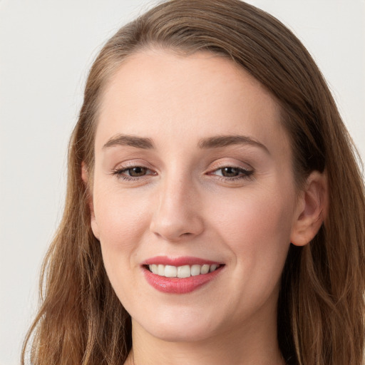 Joyful white young-adult female with long  brown hair and grey eyes