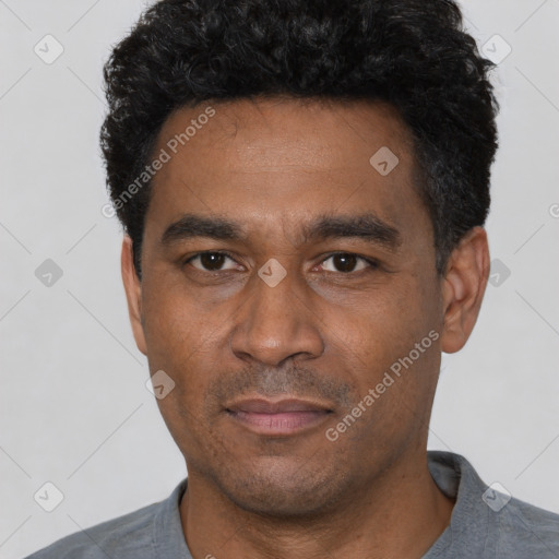Neutral latino adult male with short  black hair and brown eyes