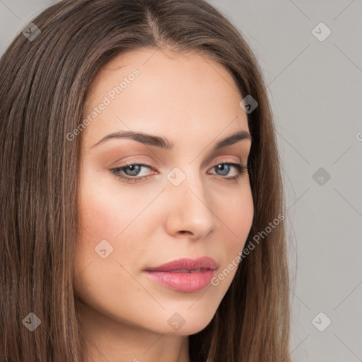 Neutral white young-adult female with long  brown hair and brown eyes