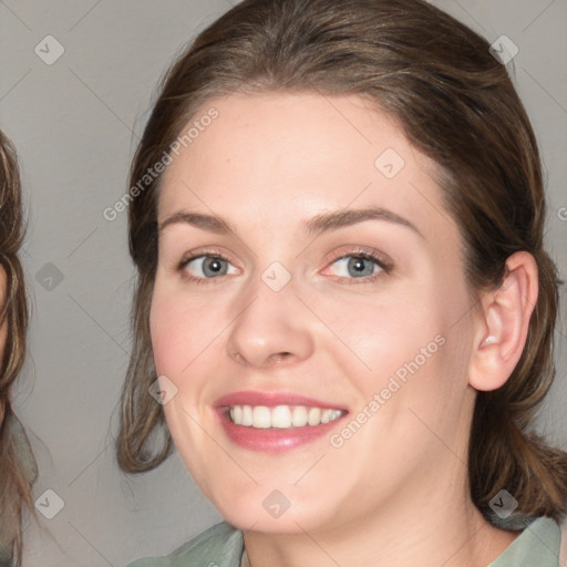 Joyful white young-adult female with medium  brown hair and blue eyes