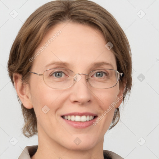 Joyful white adult female with medium  brown hair and grey eyes