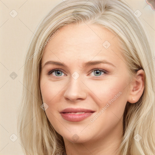 Joyful white young-adult female with long  brown hair and blue eyes