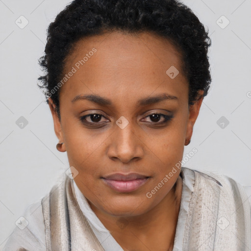 Joyful black young-adult female with short  brown hair and brown eyes