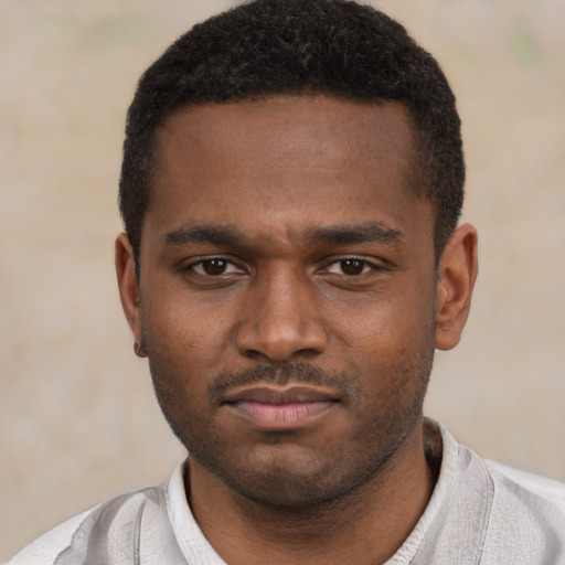 Neutral black young-adult male with short  black hair and brown eyes