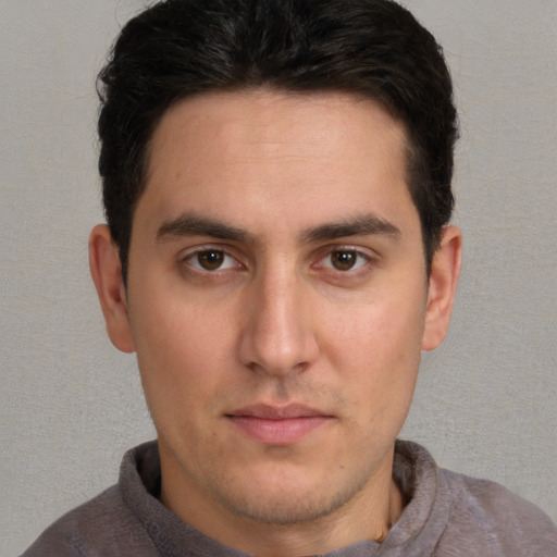Neutral white young-adult male with short  brown hair and brown eyes