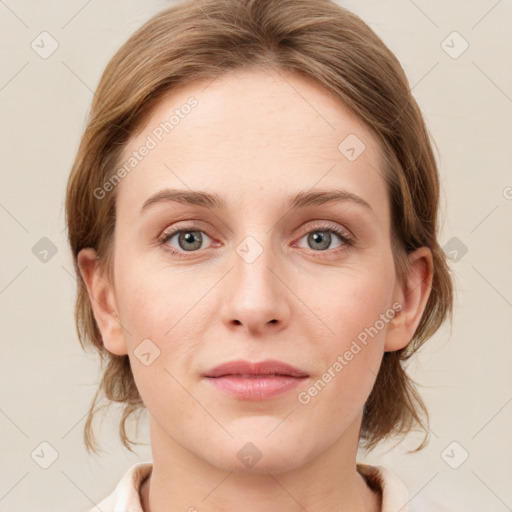 Joyful white young-adult female with medium  brown hair and blue eyes