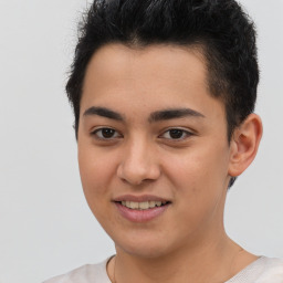 Joyful latino young-adult male with short  black hair and brown eyes