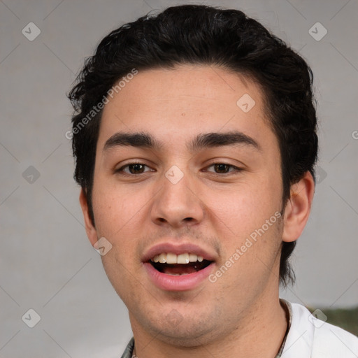 Joyful white young-adult male with short  black hair and brown eyes