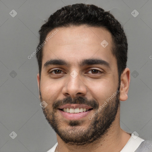 Joyful white young-adult male with short  black hair and brown eyes