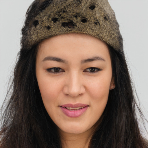 Joyful asian young-adult female with long  brown hair and brown eyes