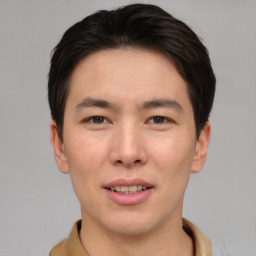 Joyful asian young-adult male with short  brown hair and brown eyes