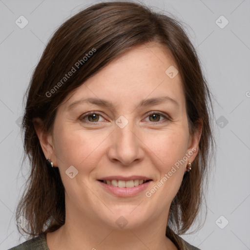 Joyful white adult female with medium  brown hair and grey eyes