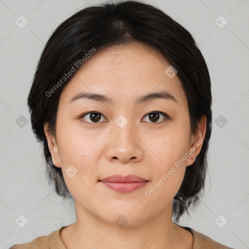 Joyful asian young-adult female with medium  black hair and brown eyes