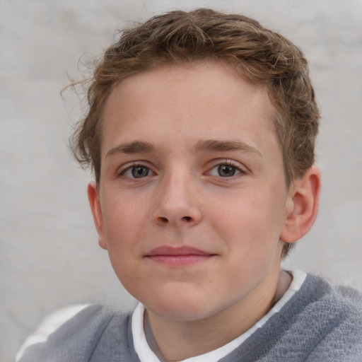 Joyful white child male with short  brown hair and grey eyes