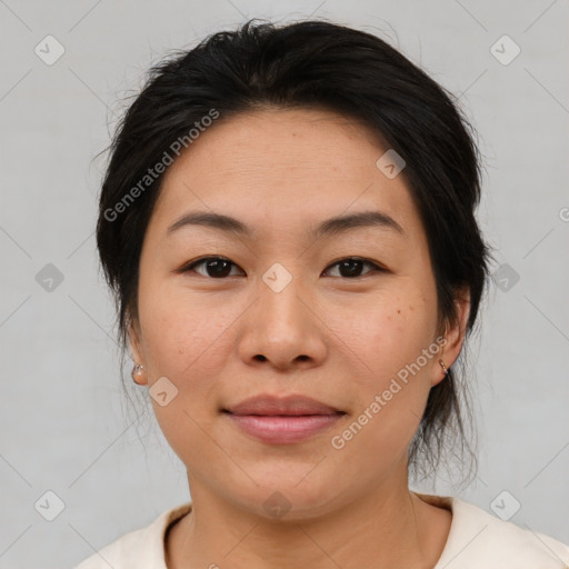 Joyful asian young-adult female with medium  brown hair and brown eyes