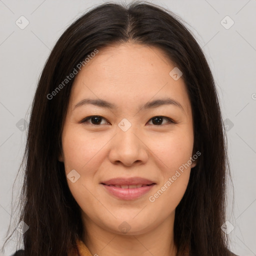 Joyful asian young-adult female with long  brown hair and brown eyes