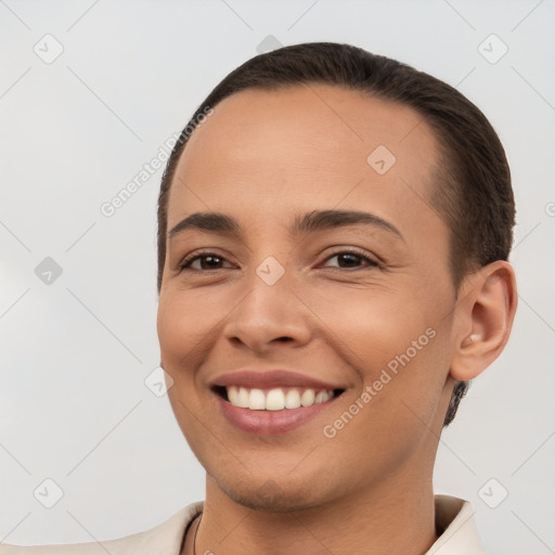 Joyful white young-adult female with short  brown hair and brown eyes