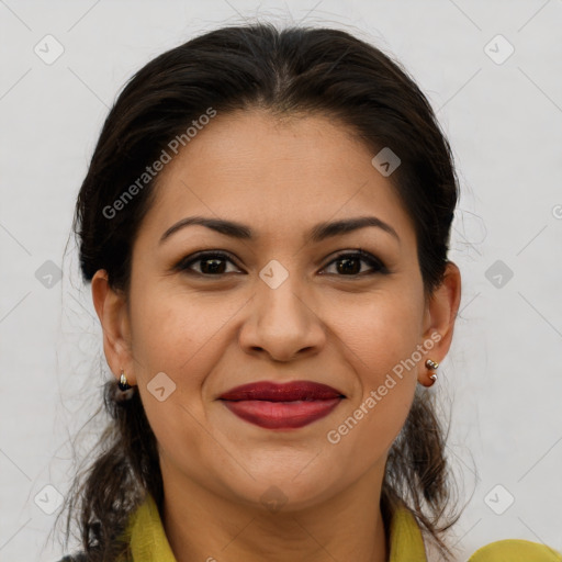 Joyful latino young-adult female with medium  brown hair and brown eyes