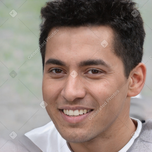 Joyful white young-adult male with short  black hair and brown eyes