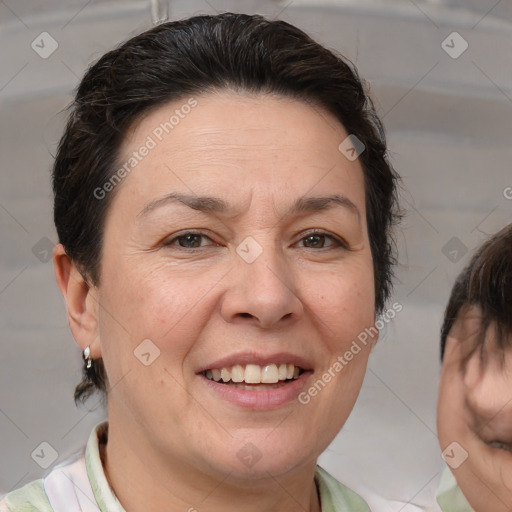 Joyful white adult female with medium  brown hair and brown eyes