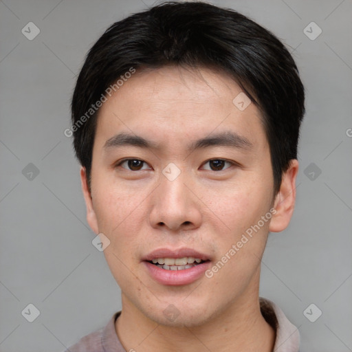 Joyful asian young-adult male with short  brown hair and brown eyes