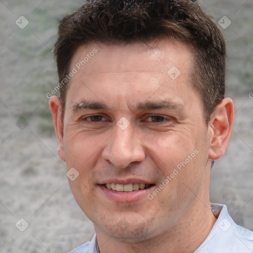 Joyful white adult male with short  brown hair and grey eyes