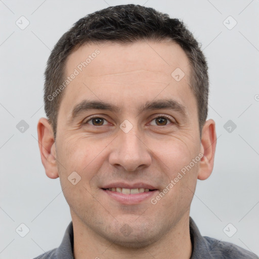 Joyful white adult male with short  brown hair and brown eyes