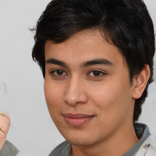 Joyful white young-adult male with medium  brown hair and brown eyes